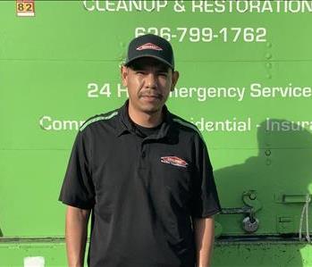 Pablo in front of SERVPRO truck