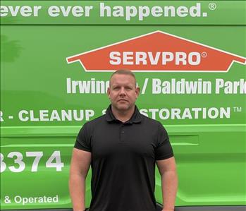 Ben in front of SERVPRO van